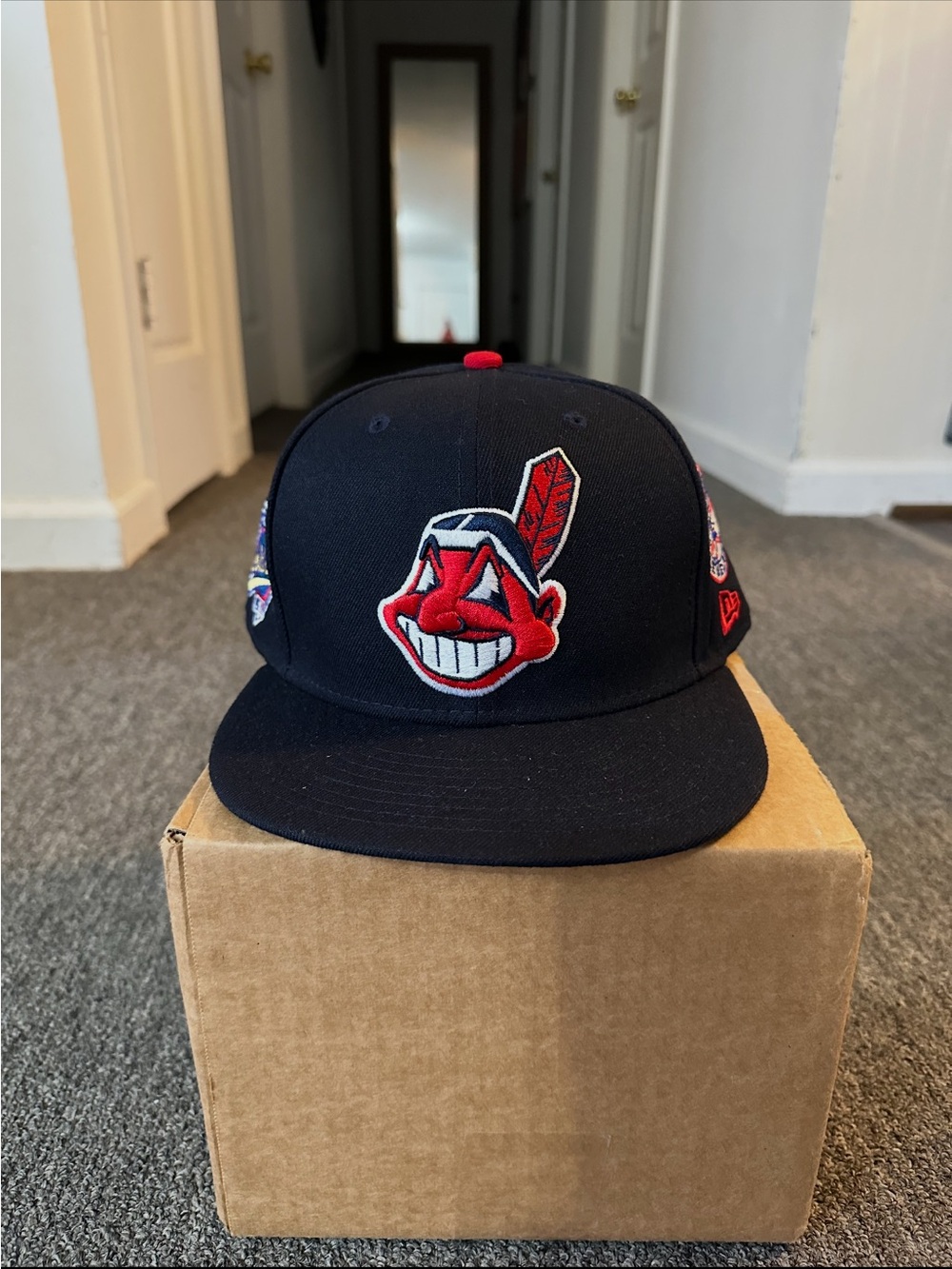 New Era Navy Snapback Hat with Red Logo Patch